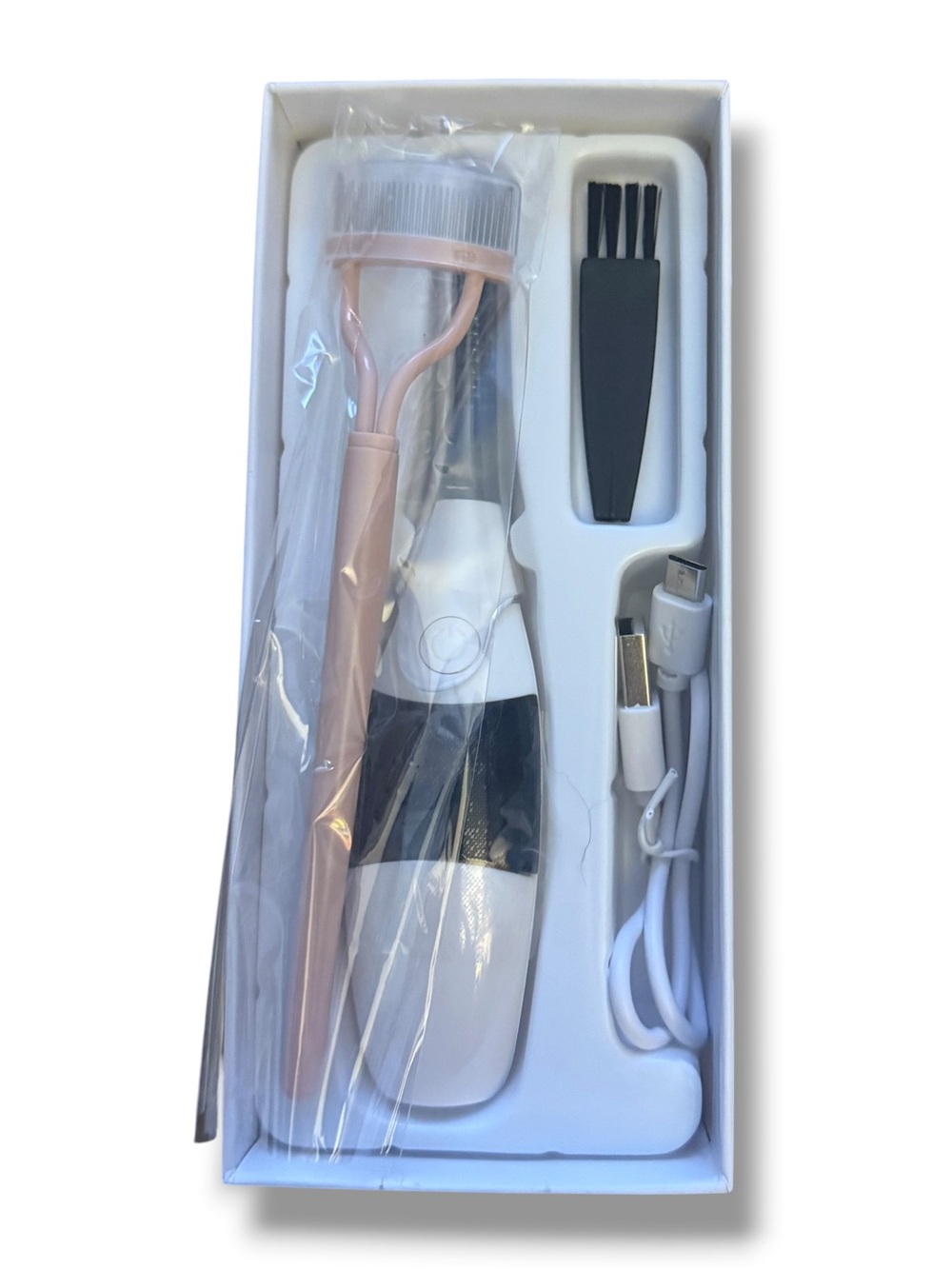 Heated eyelash curler